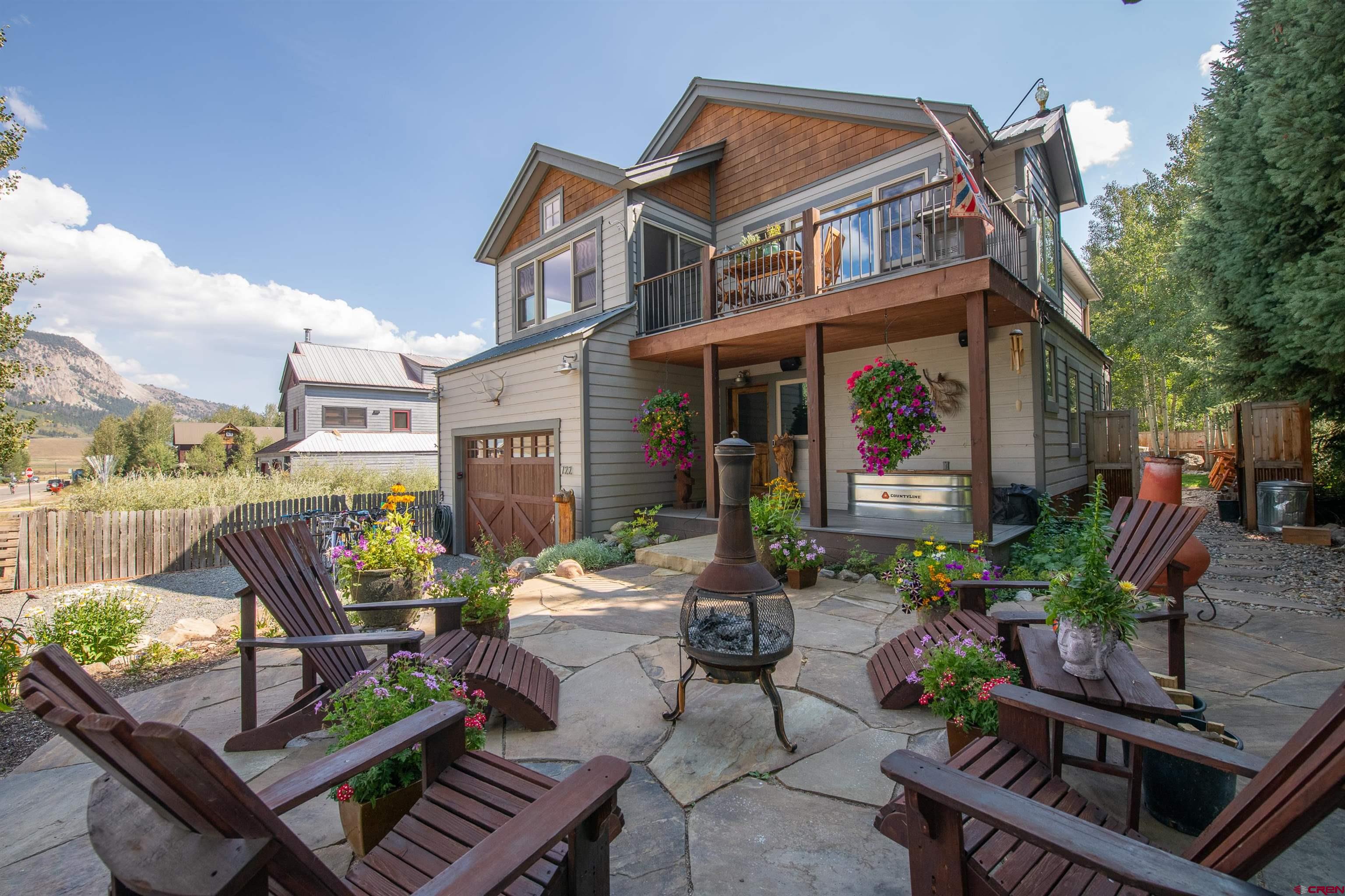 722 Elk Avenue Crested Butte, CO 81224 - Photo 5 of 32 a view of a patio with couches table and chairs