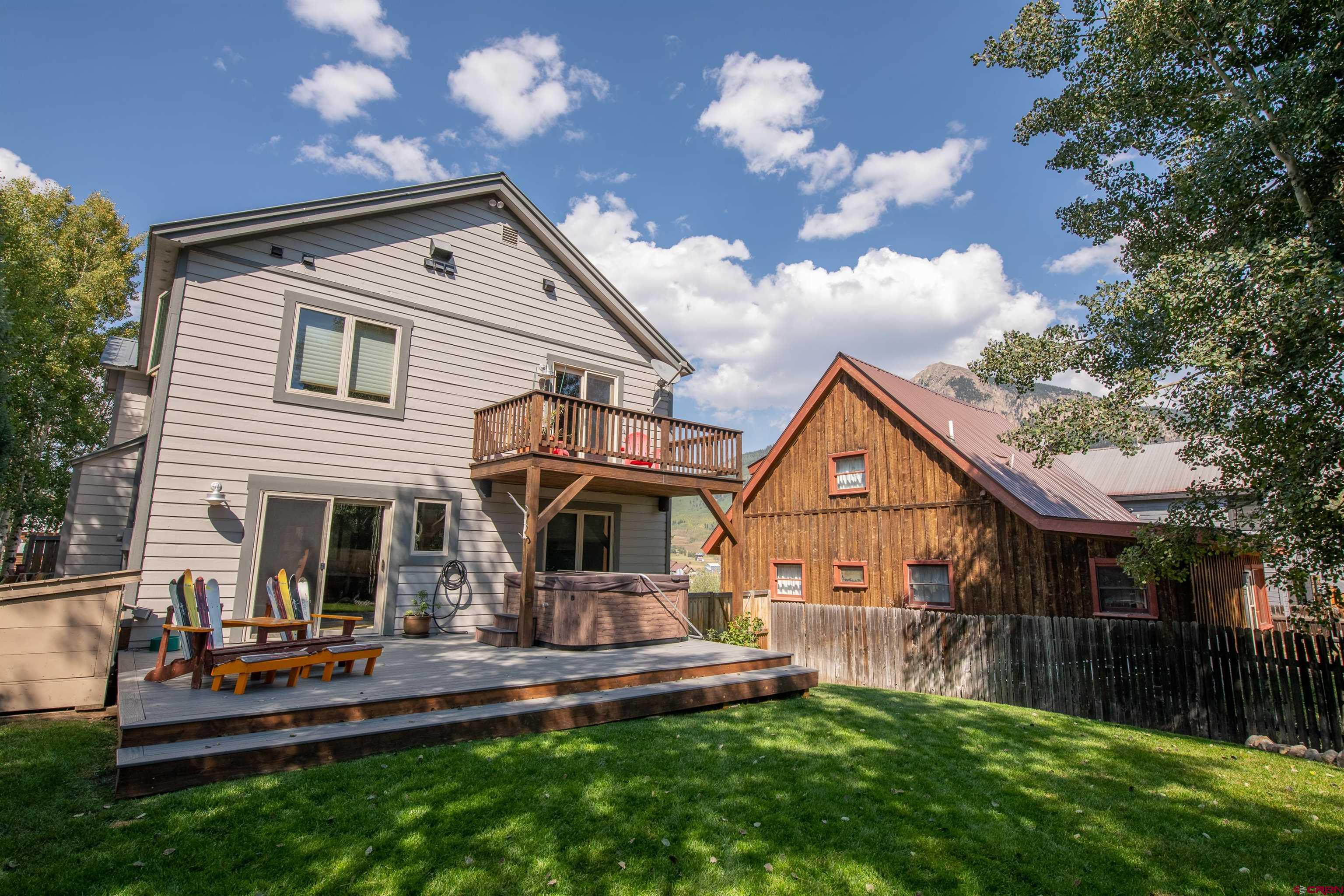 722 Elk Avenue Crested Butte, CO 81224 - Photo 7 of 32 a front view of house with yard and outdoor seating