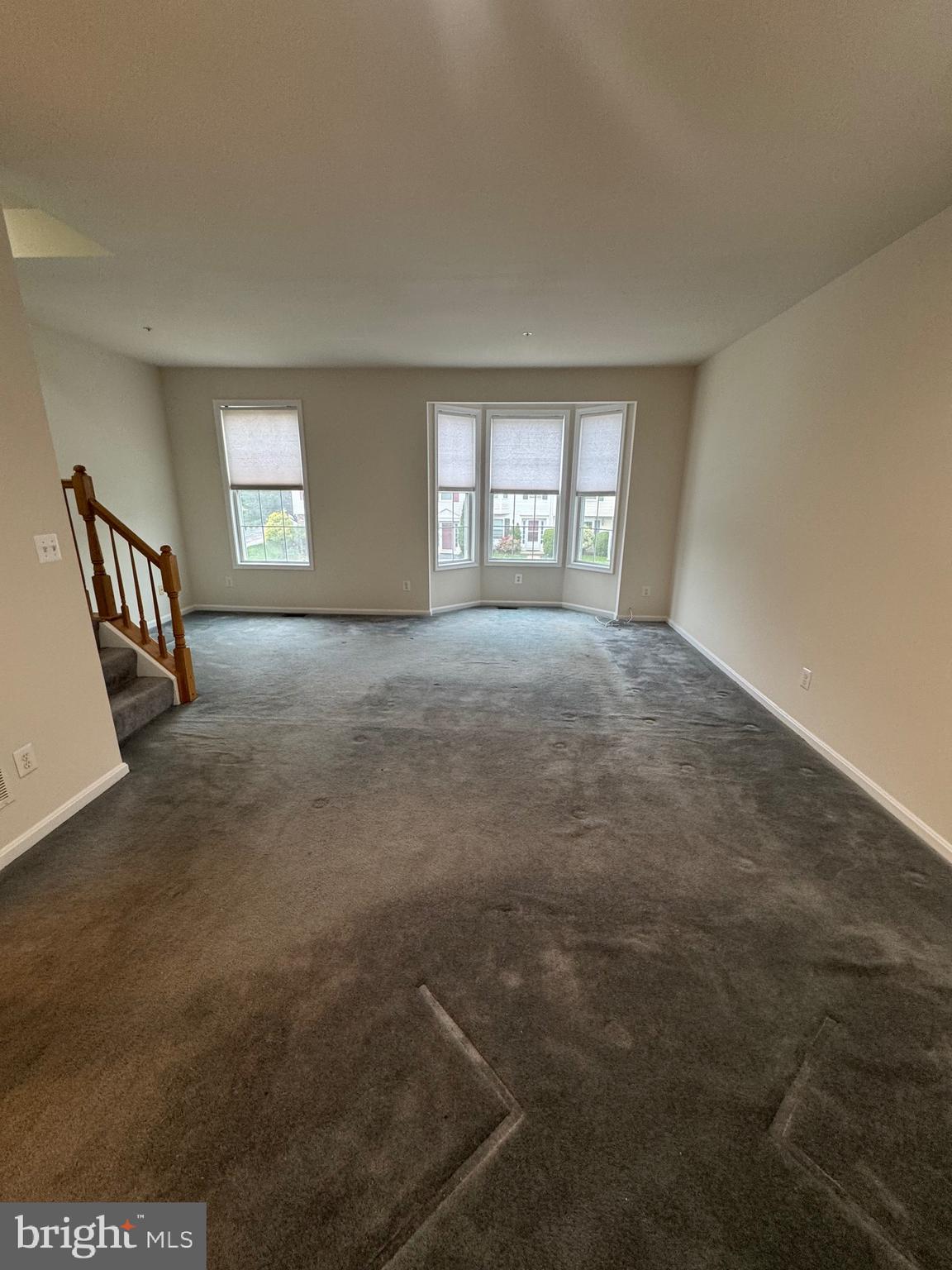 7705 Periwinkle Way, Unit 71 Severn, MD 21144 - Photo 10 of 28 an empty room with windows