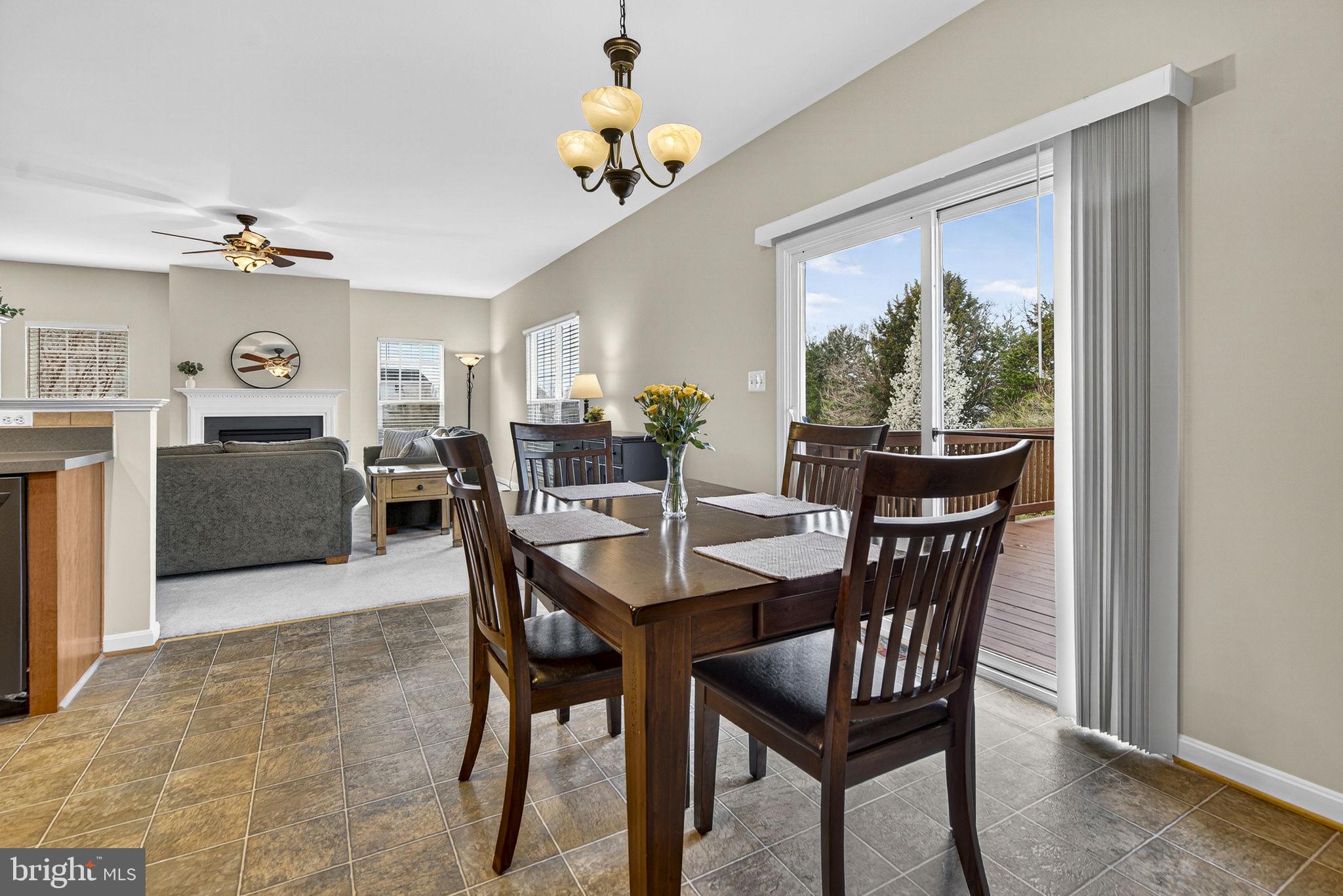 742 Blossom Tree Road Culpeper, VA 22701 - Photo 24 of 60 a view of a dining room with furniture window and wooden floor