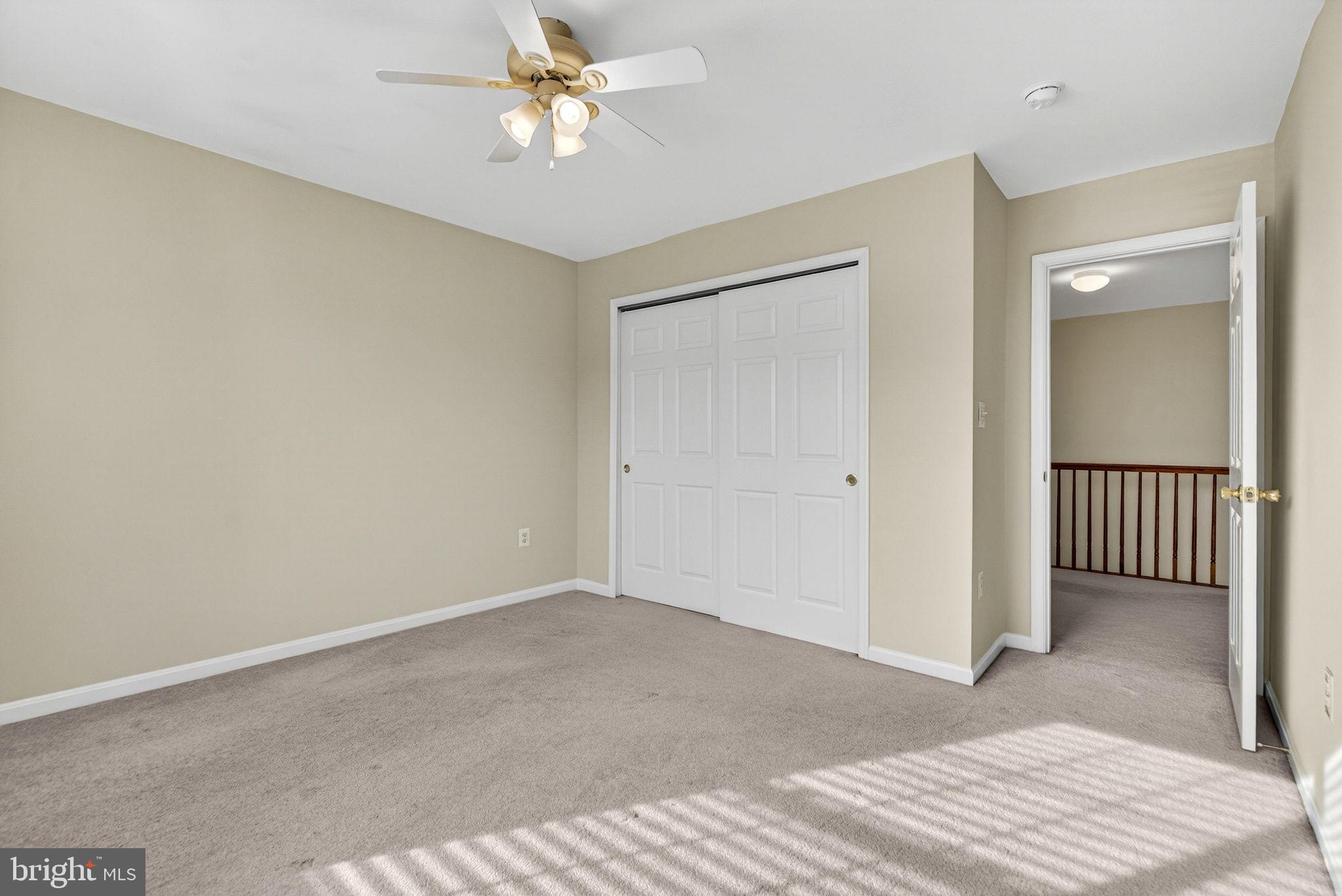 742 Blossom Tree Road Culpeper, VA 22701 - Photo 30 of 60 a view of a room with a ceiling fan and hardwood floor