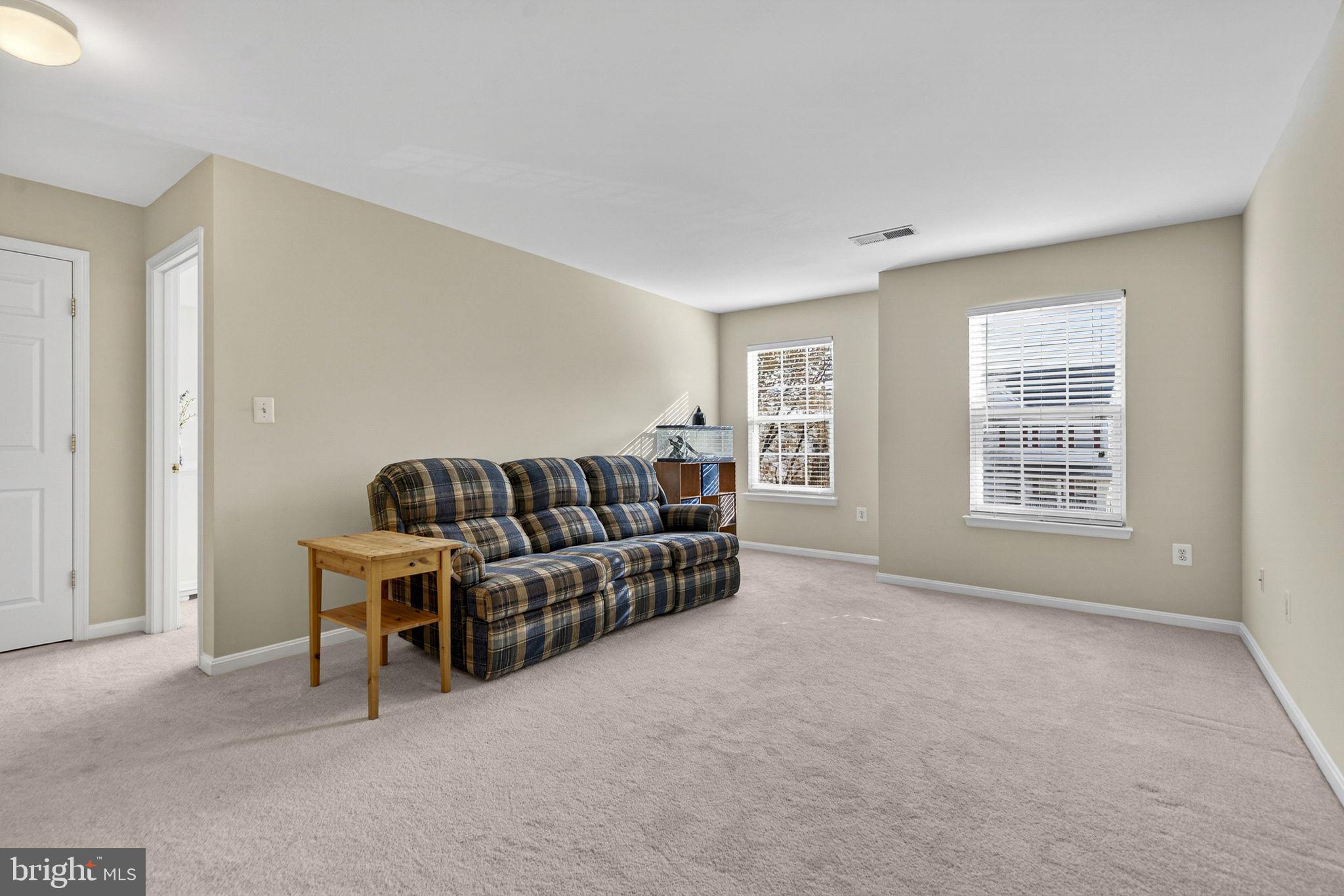 742 Blossom Tree Road Culpeper, VA 22701 - Photo 31 of 60 a living room with furniture and a window