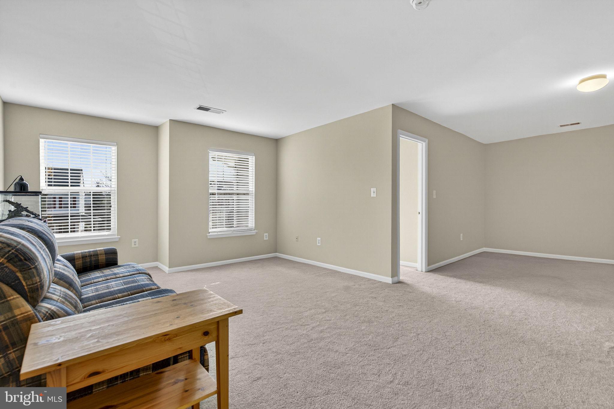742 Blossom Tree Road Culpeper, VA 22701 - Photo 32 of 60 a living room with furniture and a window