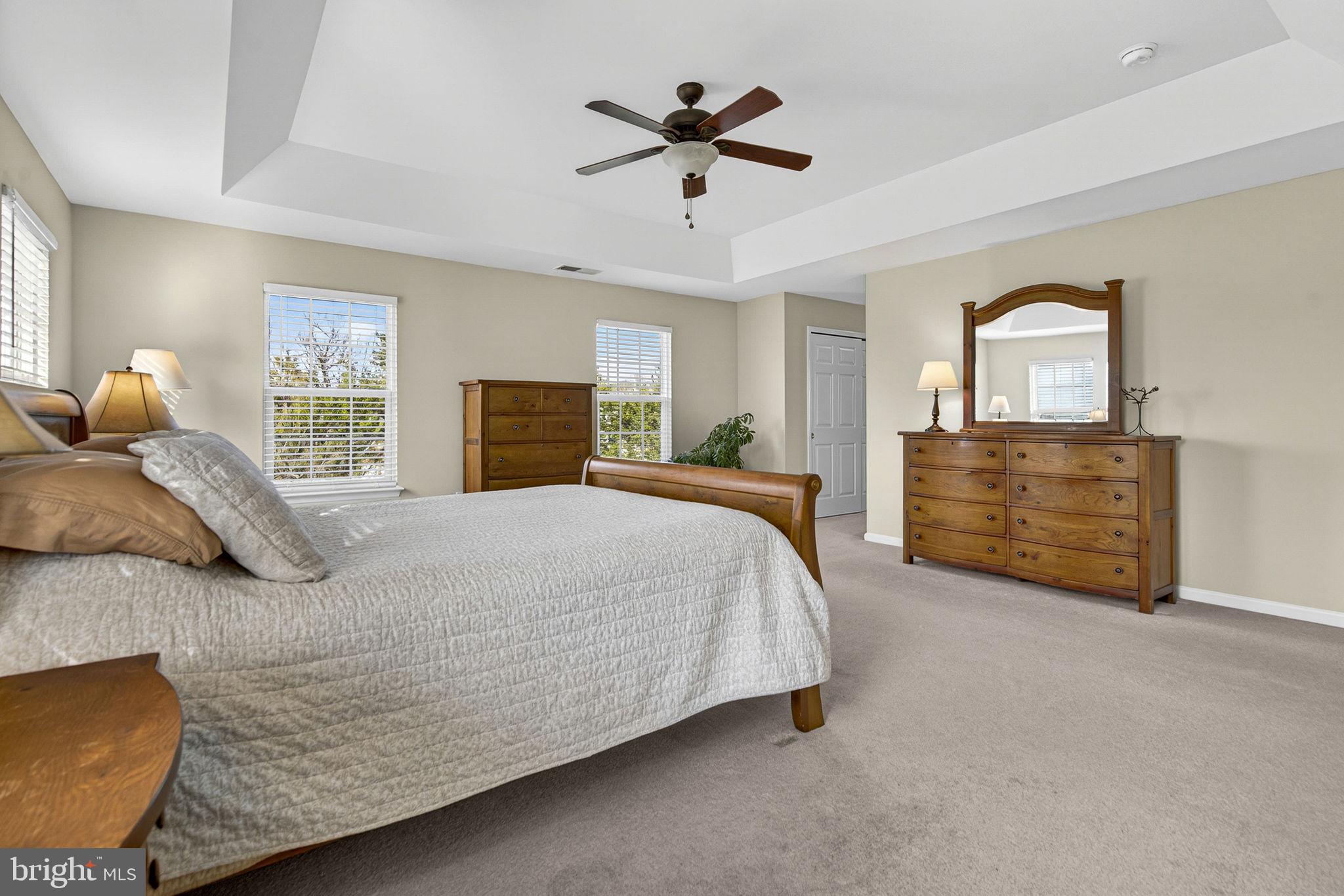 742 Blossom Tree Road Culpeper, VA 22701 - Photo 34 of 60 a bed room with a bed and a ceiling fan