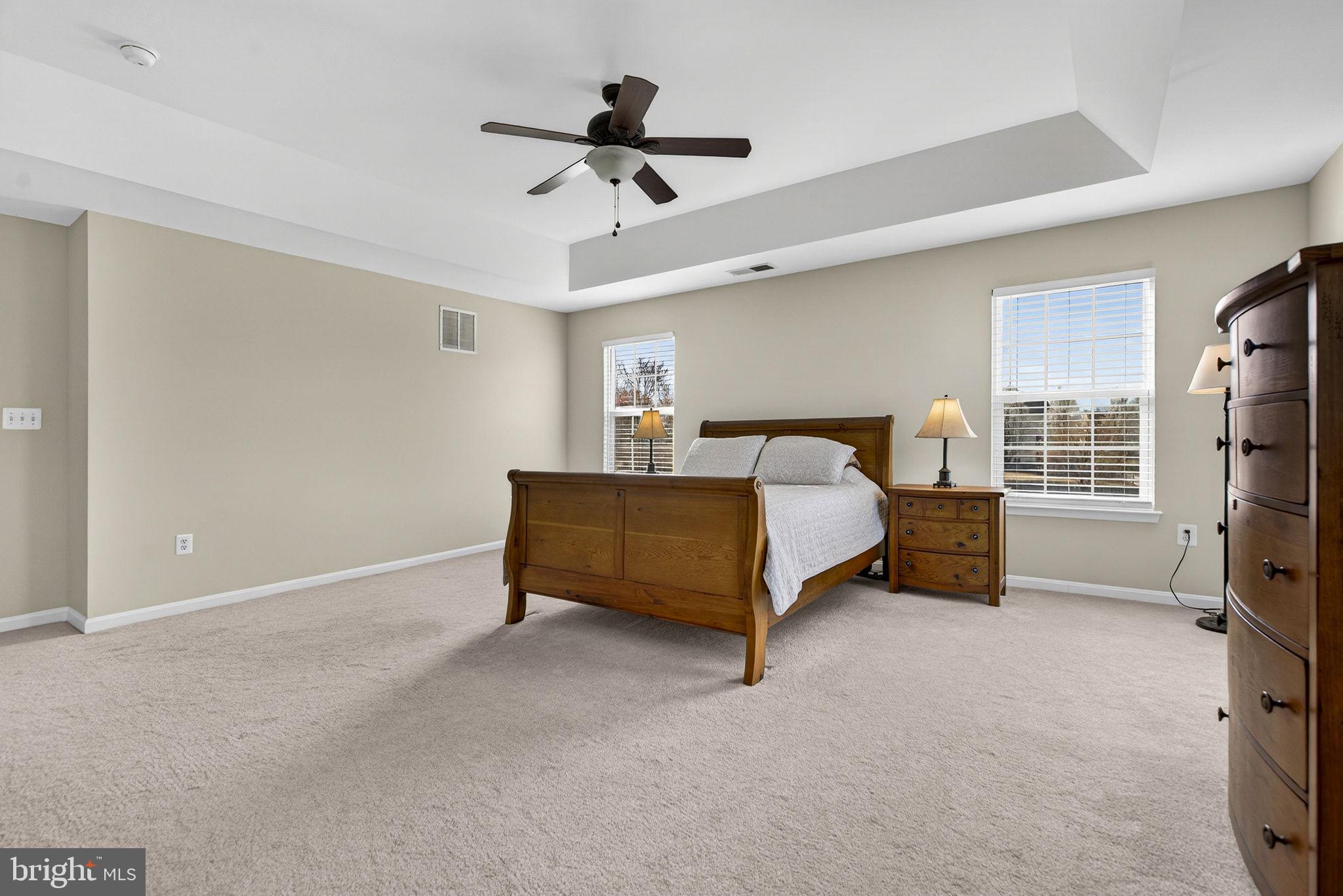 742 Blossom Tree Road Culpeper, VA 22701 - Photo 35 of 60 a bedroom with a bed and a tv