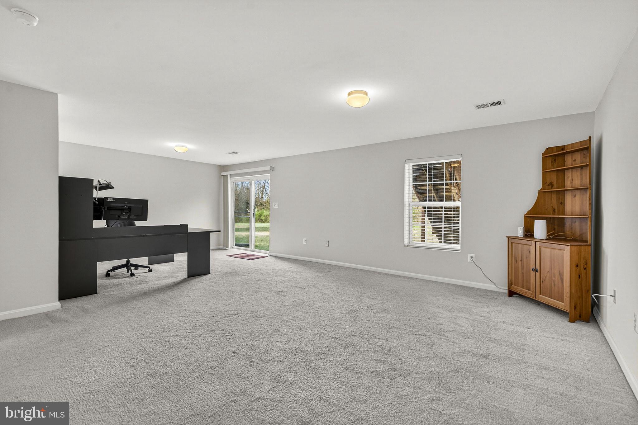 742 Blossom Tree Road Culpeper, VA 22701 - Photo 46 of 60 a view of a livingroom with furniture and a flat screen tv