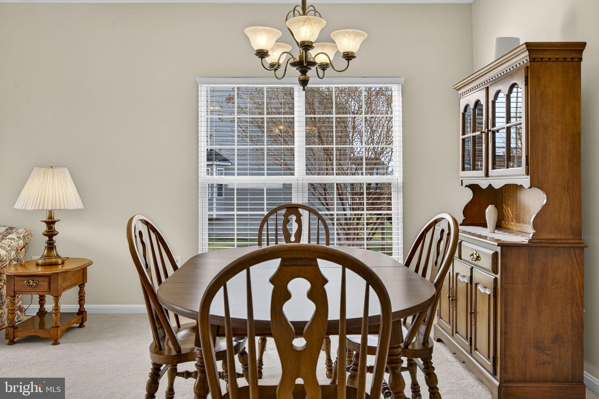 742 Blossom Tree Road Culpeper, VA 22701 - Photo 9 of 60 a view of a dining room with furniture and chandelier