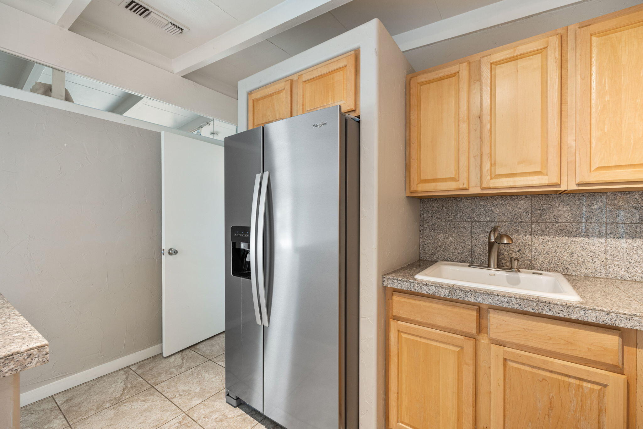 71996 Vista Del Rio Rancho Mirage, CA 92270 - Photo 11 of 39 a kitchen with stainless steel appliances granite countertop a refrigerator and a sink