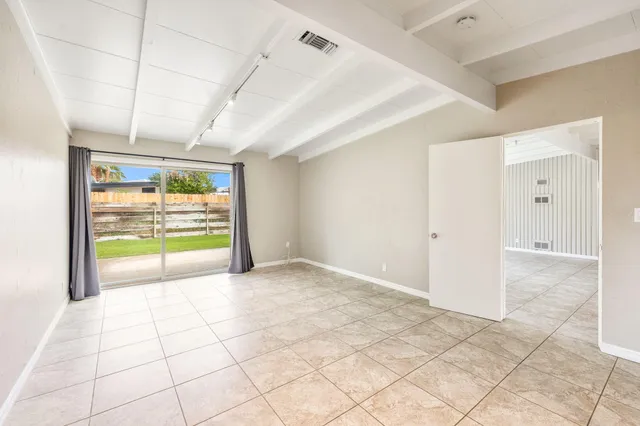a view of an empty room and window