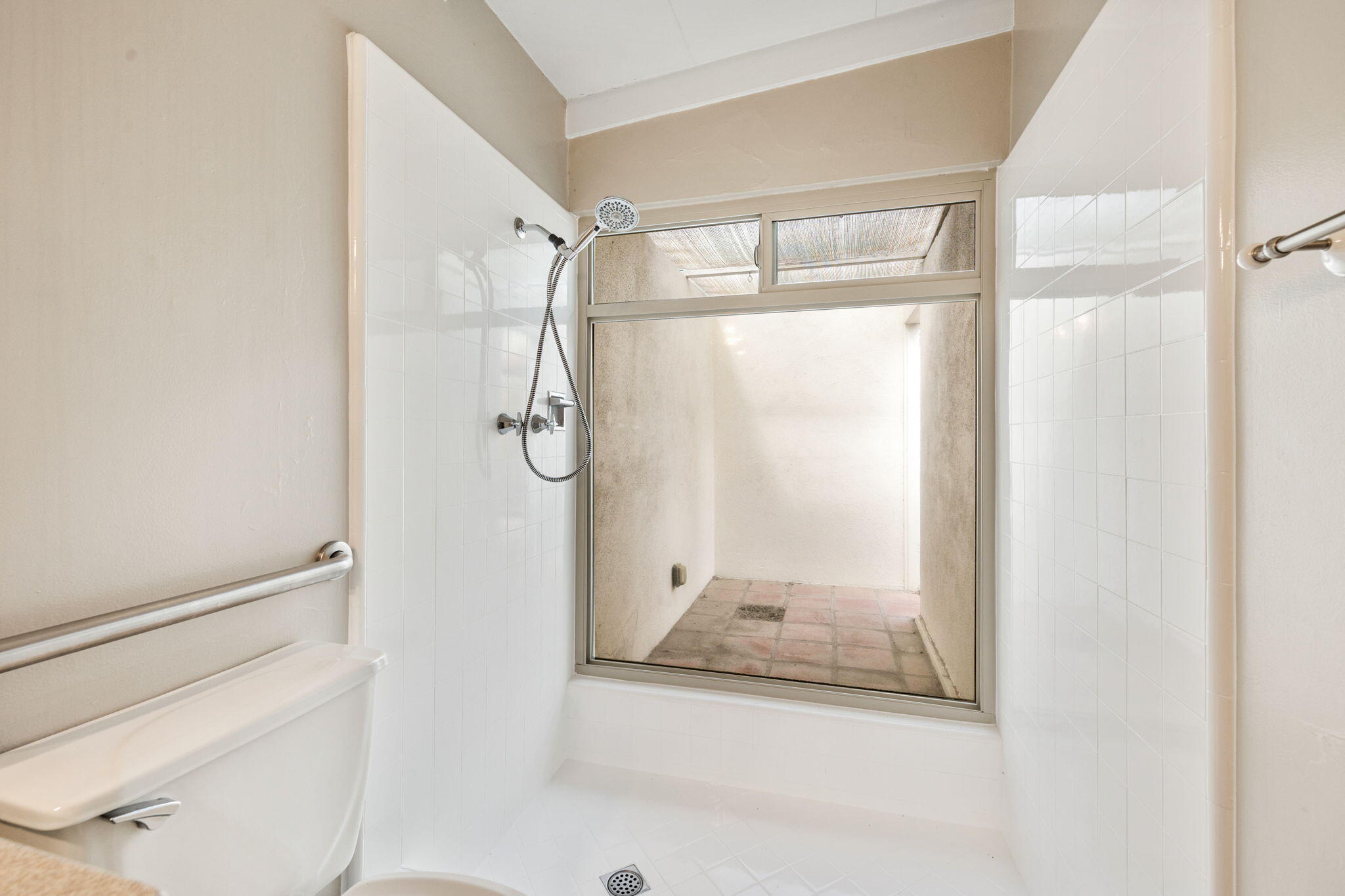 71996 Vista Del Rio Rancho Mirage, CA 92270 - Photo 18 of 39 a bathroom with a glass shower door