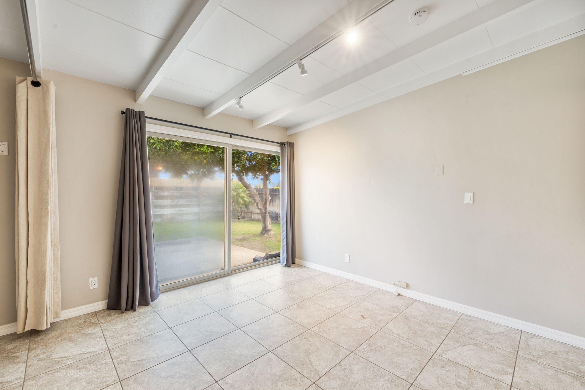 71996 Vista Del Rio Rancho Mirage, CA 92270 - Photo 20 of 39 an empty room with sliding glass door