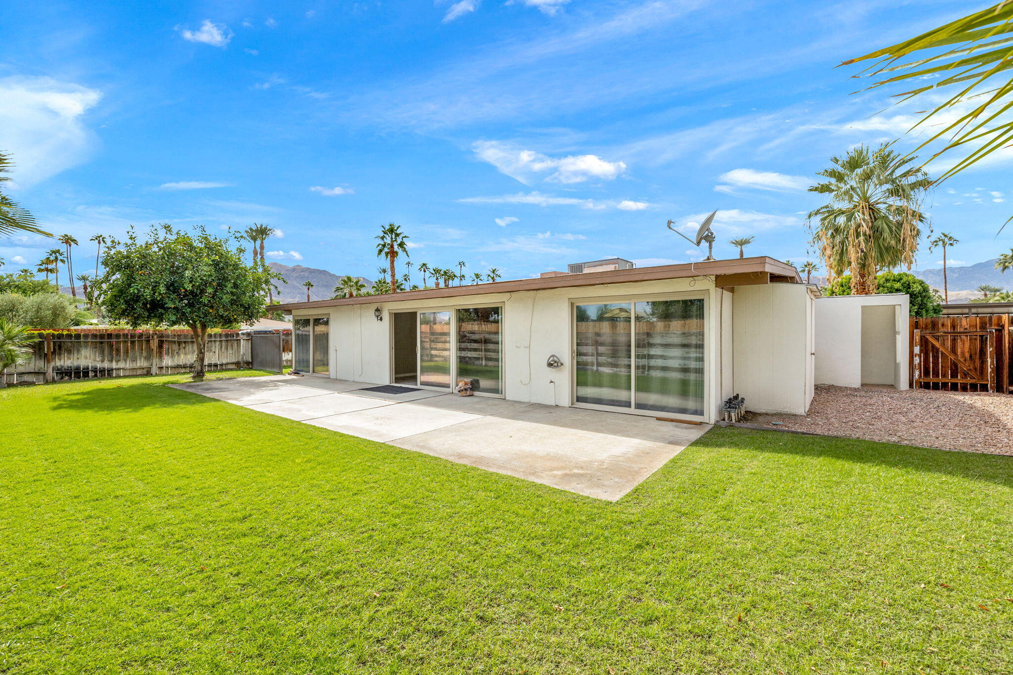 71996 Vista Del Rio Rancho Mirage, CA 92270 - Photo 28 of 39 a view of a house with a yard and a patio