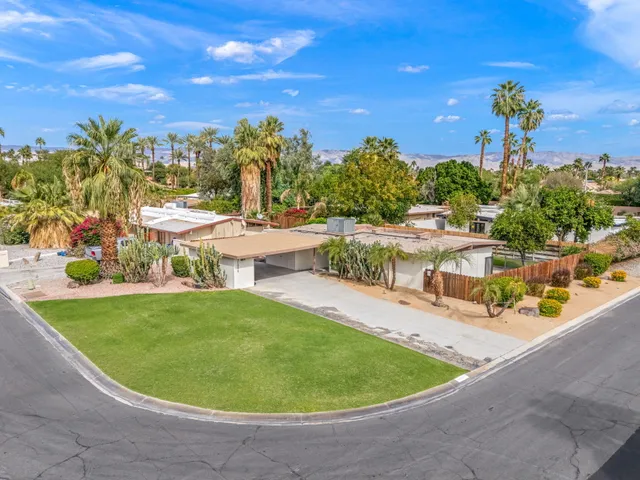 a view of a swimming pool with an outdoor space and seating area