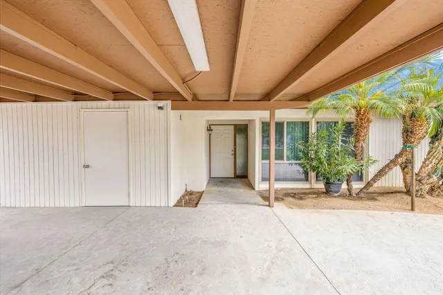 a view of a porch with wooden floor and stairs