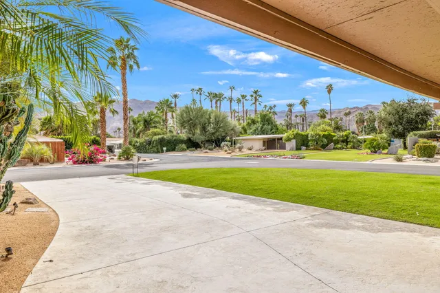 a view of a swimming pool with an outdoor seating