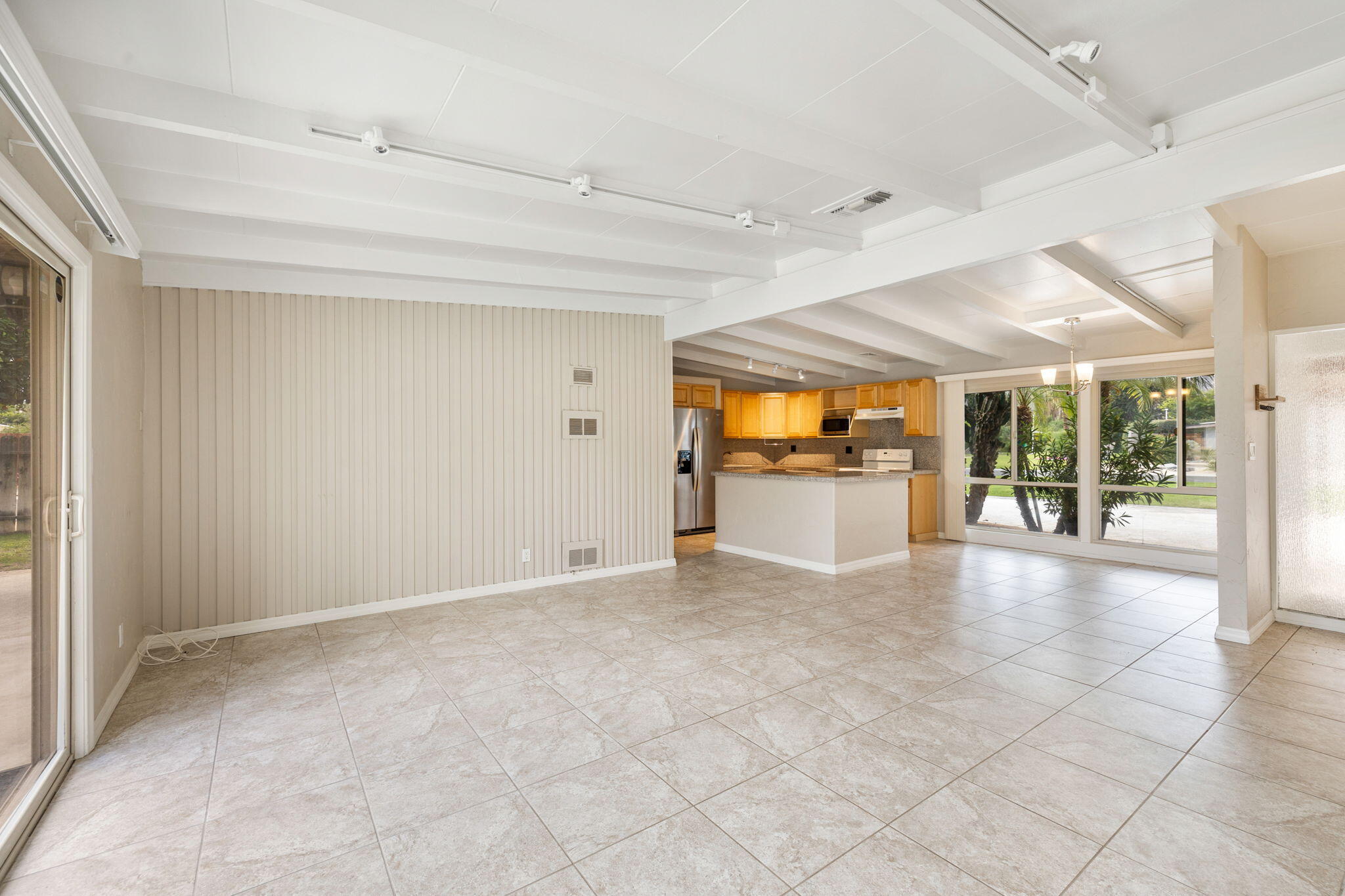 71996 Vista Del Rio Rancho Mirage, CA 92270 - Photo 4 of 39 an empty room with wooden floor and windows