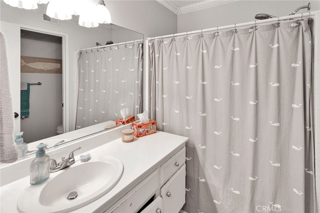 20403 Ochoa Road Apple Valley, CA 92307 - Photo 40 of 48 a bathroom with a double vanity sink and a mirror