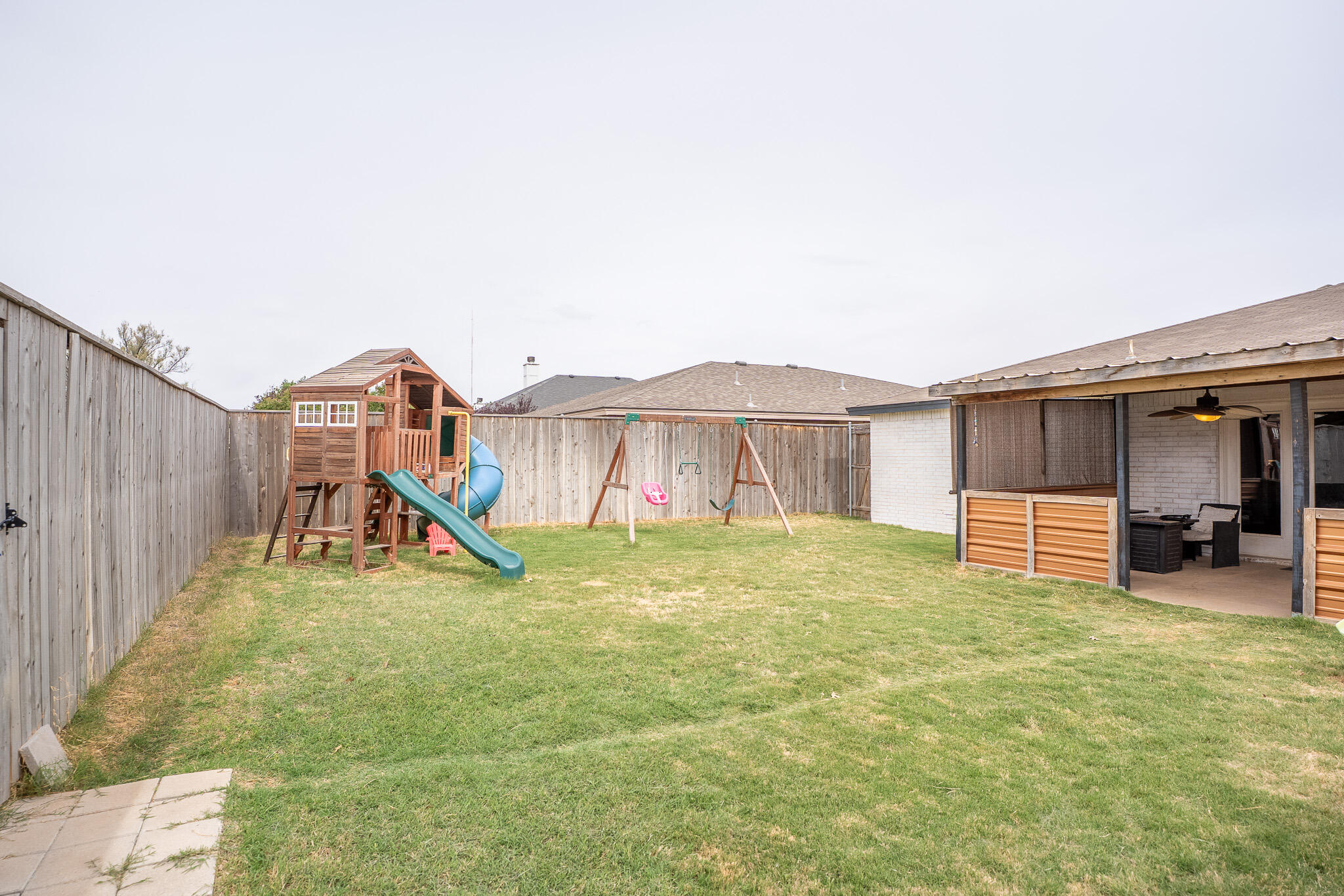1609 78th Street Lubbock, TX 79423 - Photo 33 of 36 a view of a house with backyard and porch