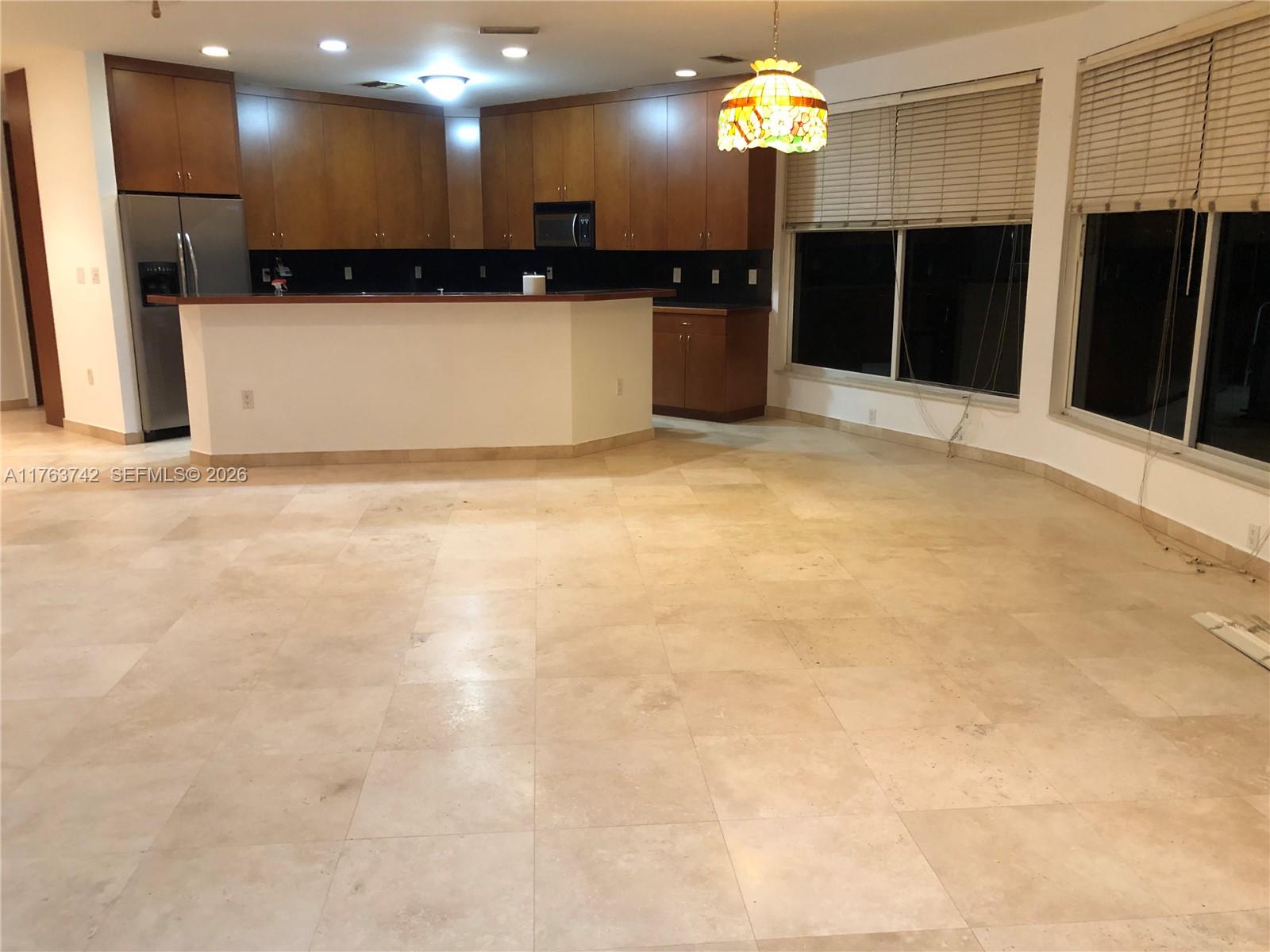 4750 Southwest 43rd Avenue Dania Beach, FL 33314 - Photo 16 of 28 a view of kitchen with refrigerator and microwave