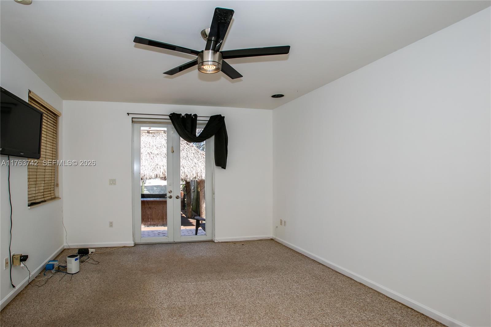 4750 Southwest 43rd Avenue Dania Beach, FL 33314 - Photo 17 of 28 a view of a livingroom with a ceiling fan and window