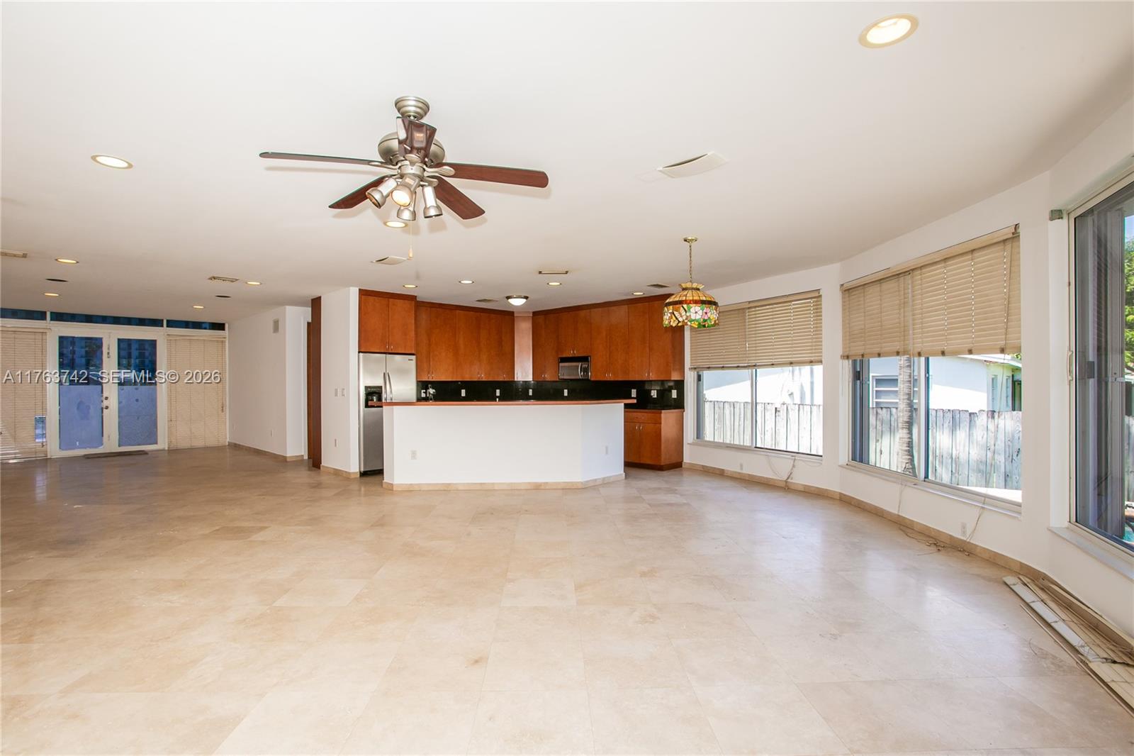 4750 Southwest 43rd Avenue Dania Beach, FL 33314 - Photo 8 of 28 a view of a kitchen with furniture and a ceiling fan