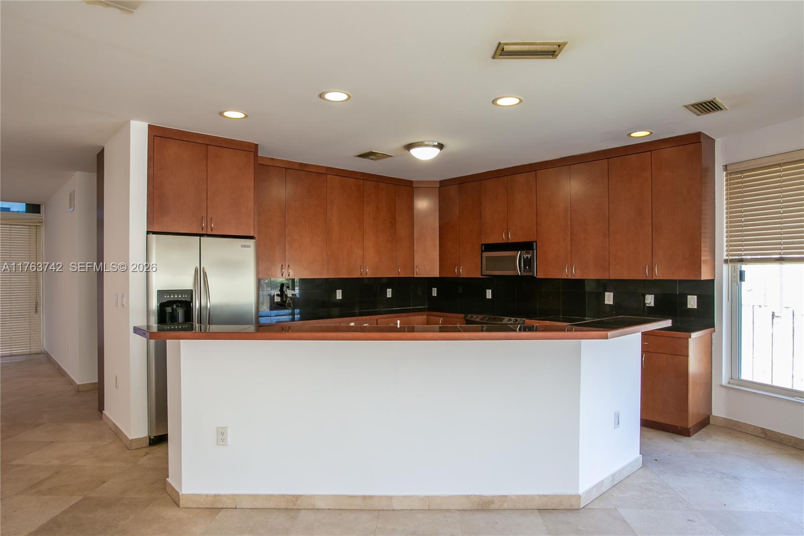 4750 Southwest 43rd Avenue Dania Beach, FL 33314 - Photo 10 of 28 a large kitchen with stainless steel appliances a large counter top