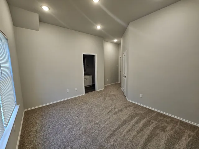an empty room with a hallway