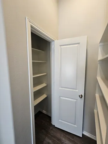 a view of an empty walk in closet