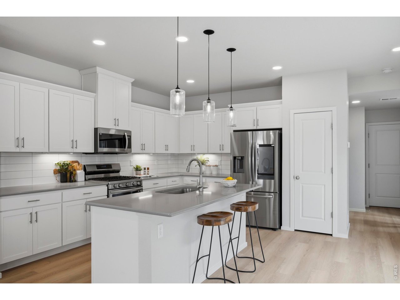5230 Rendezvous Parkway Timnath, CO 80547 - Photo 13 of 31 Kitchen with Gas Range and Stainless Steel Appliances