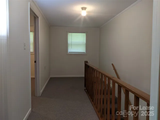 a view of hallway with stairs