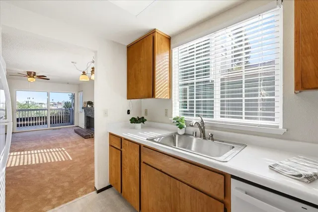 a bathroom with a double vanity sink toilet and shower