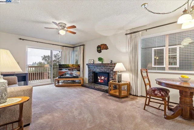 a view of a livingroom with furniture and a fireplace