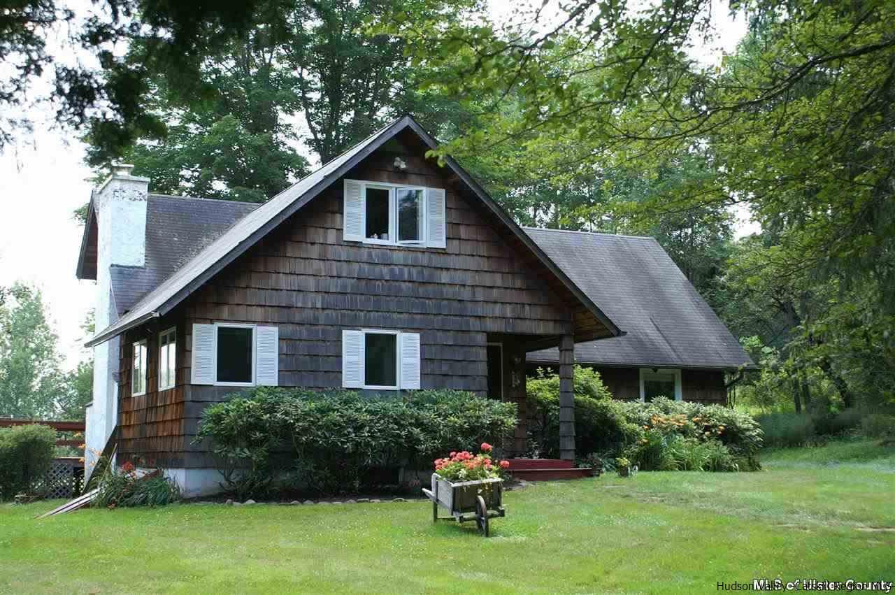 23 Deer Run Road Roxbury, NY 12421 - Photo 1 of 31 a backyard of a house with lots of green space