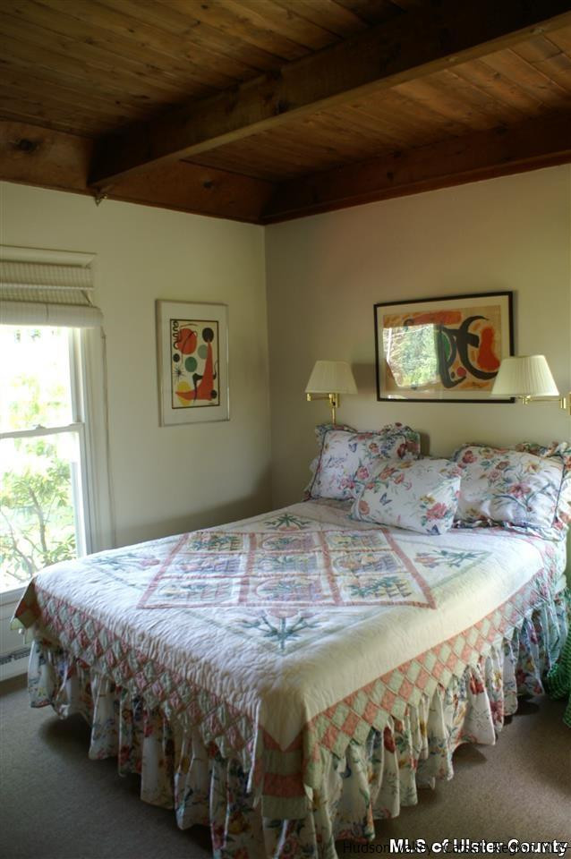 23 Deer Run Road Roxbury, NY 12421 - Photo 17 of 31 a bedroom with a bed and window