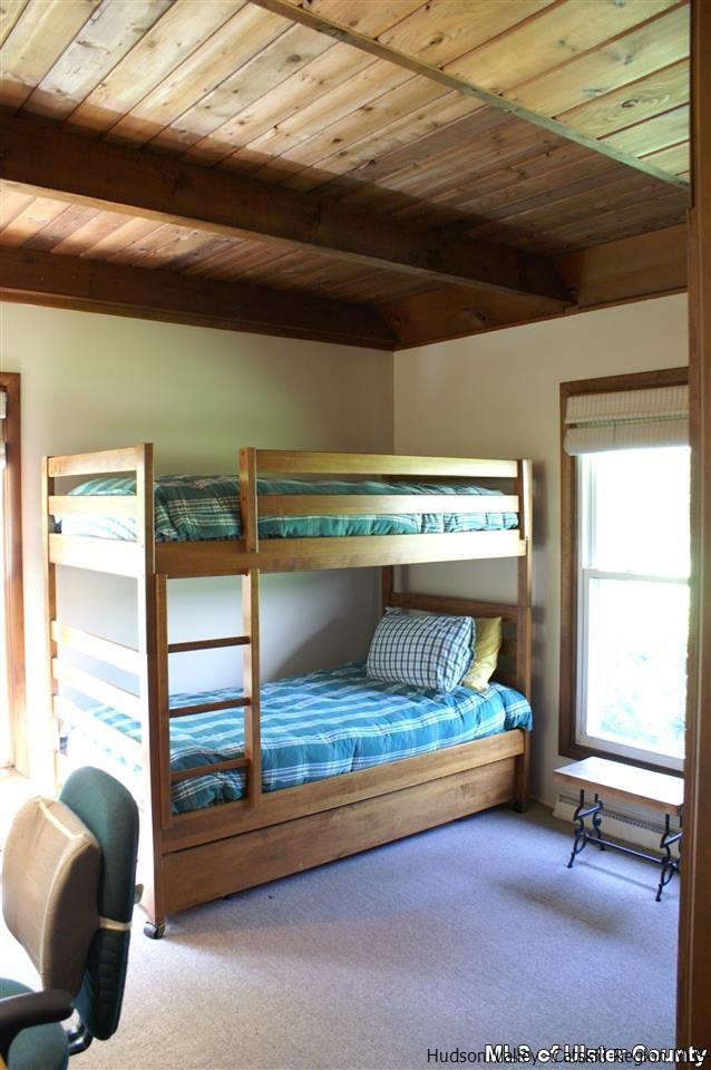 23 Deer Run Road Roxbury, NY 12421 - Photo 20 of 31 a bedroom with furniture and a window