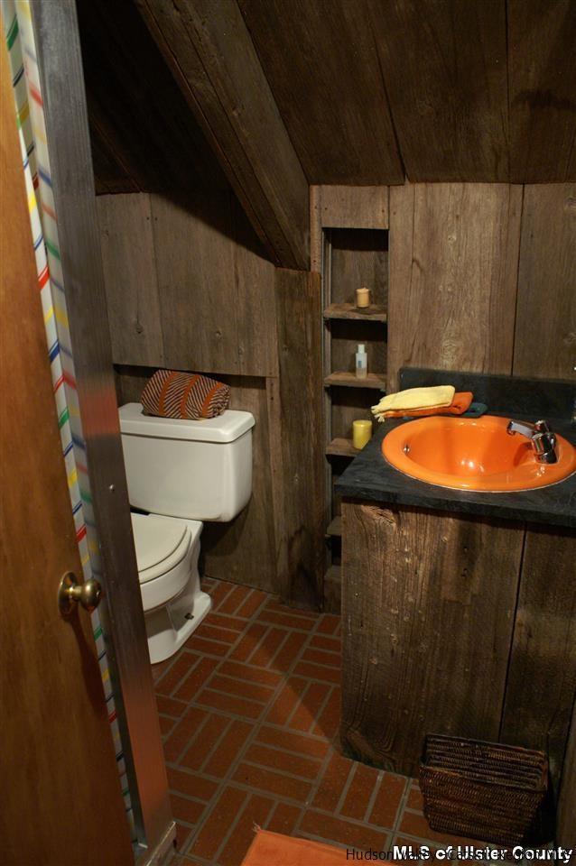 23 Deer Run Road Roxbury, NY 12421 - Photo 23 of 31 a bathroom with a toilet and a mirror