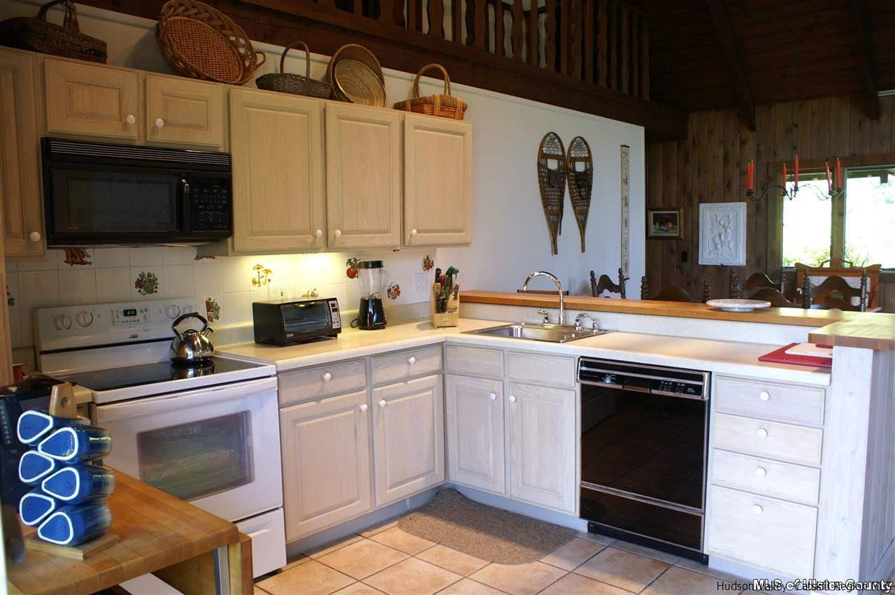 23 Deer Run Road Roxbury, NY 12421 - Photo 4 of 31 a kitchen with stainless steel appliances granite countertop a sink stove and microwave