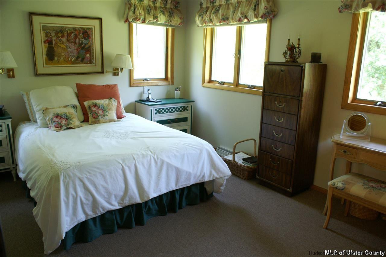 23 Deer Run Road Roxbury, NY 12421 - Photo 5 of 31 a bedroom with a bed dresser and a window