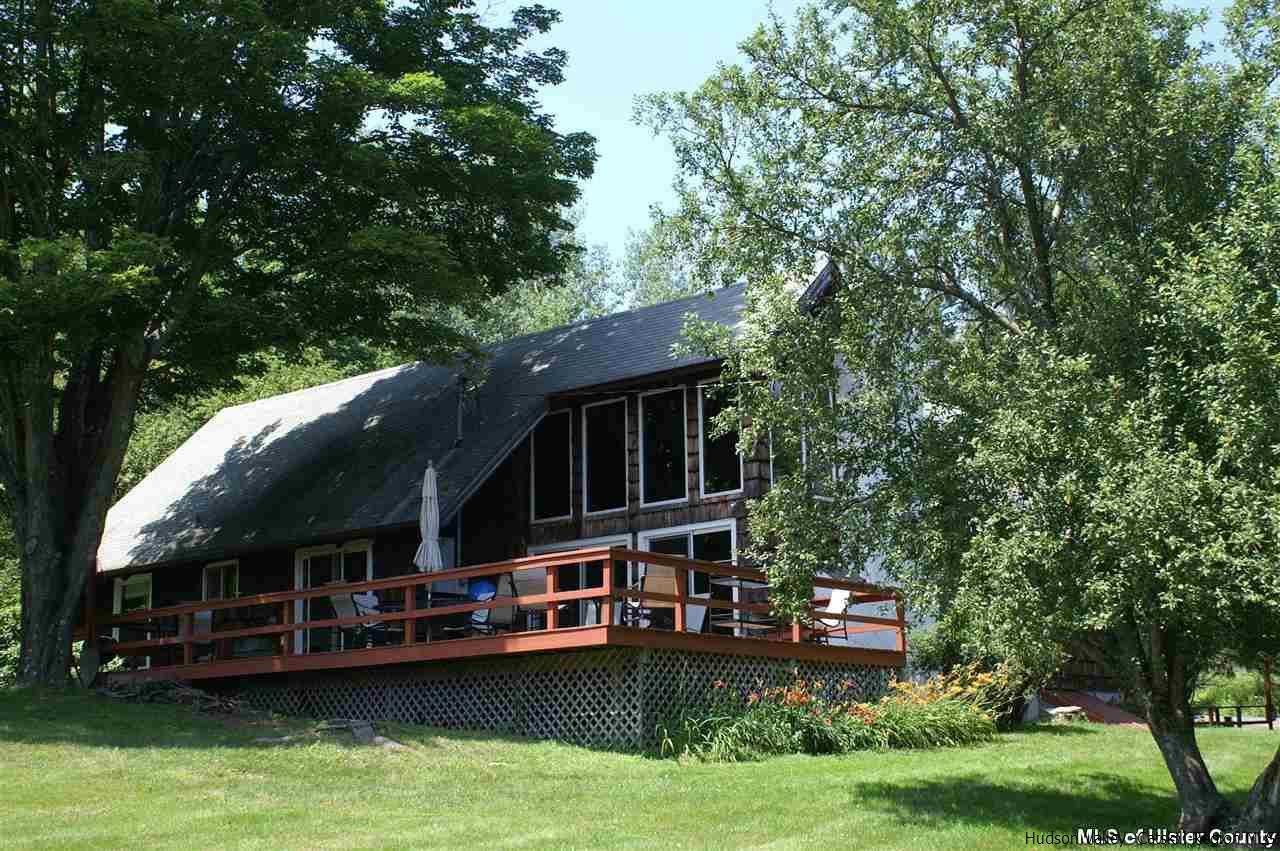 23 Deer Run Road Roxbury, NY 12421 - Photo 8 of 31 a view of swimming pool with lawn chairs and plants