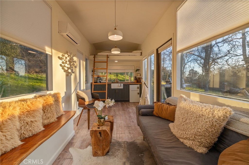 33940 Jennifer Way Coarsegold, CA 93614 - Photo 12 of 75 a living room with furniture and a large window