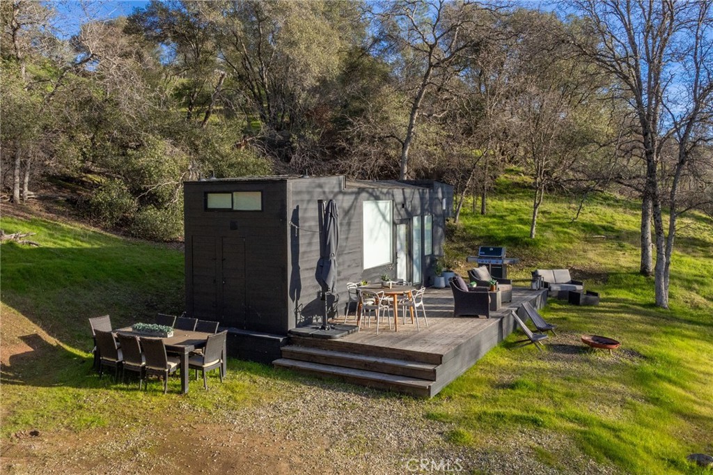 33940 Jennifer Way Coarsegold, CA 93614 - Photo 20 of 75 a view of a swimming pool with chairs in patio