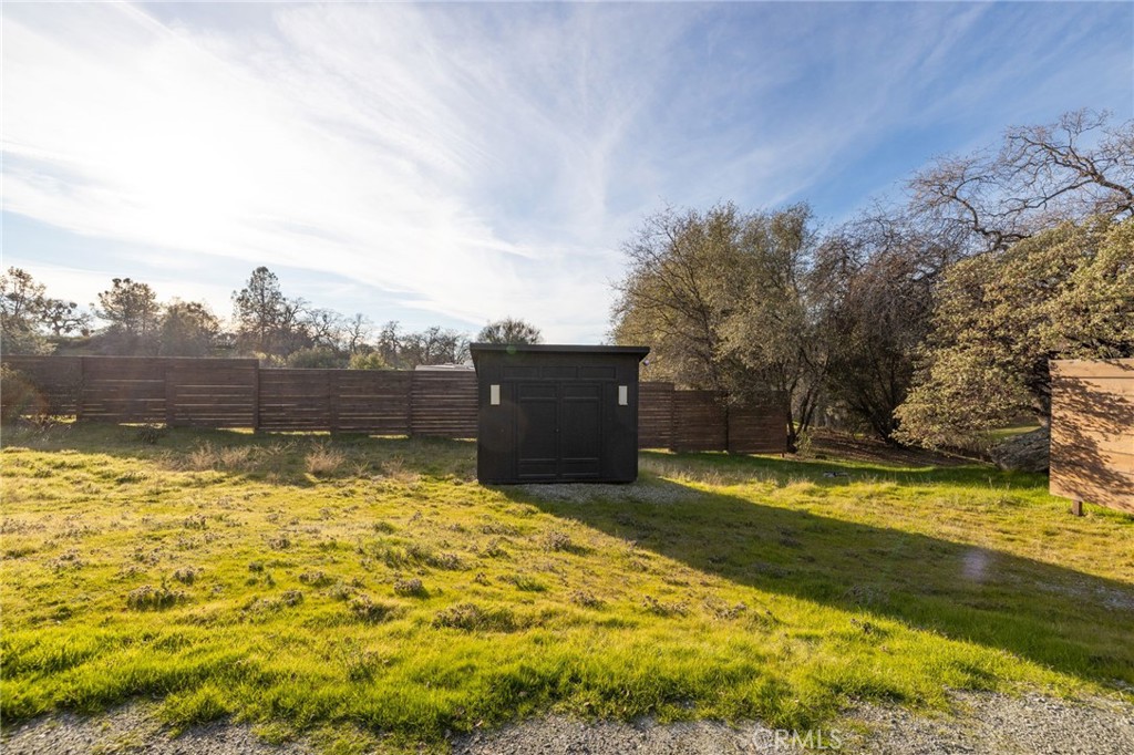33940 Jennifer Way Coarsegold, CA 93614 - Photo 22 of 75 a view of a swimming pool with an outdoor space and seating area