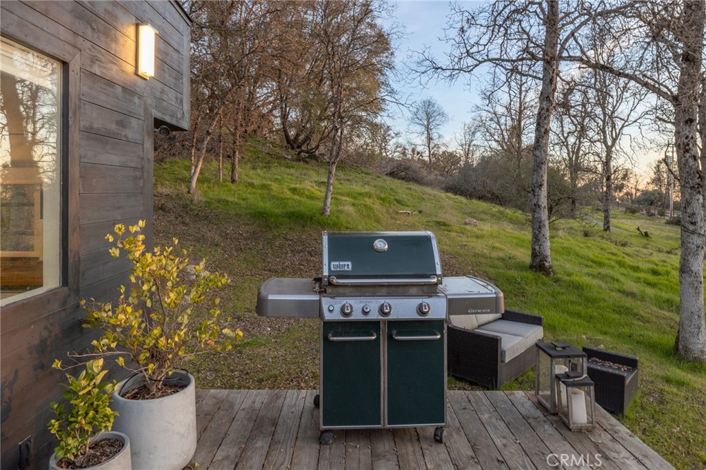 33940 Jennifer Way Coarsegold, CA 93614 - Photo 65 of 75 a view of a chairs and table on the wooden deck