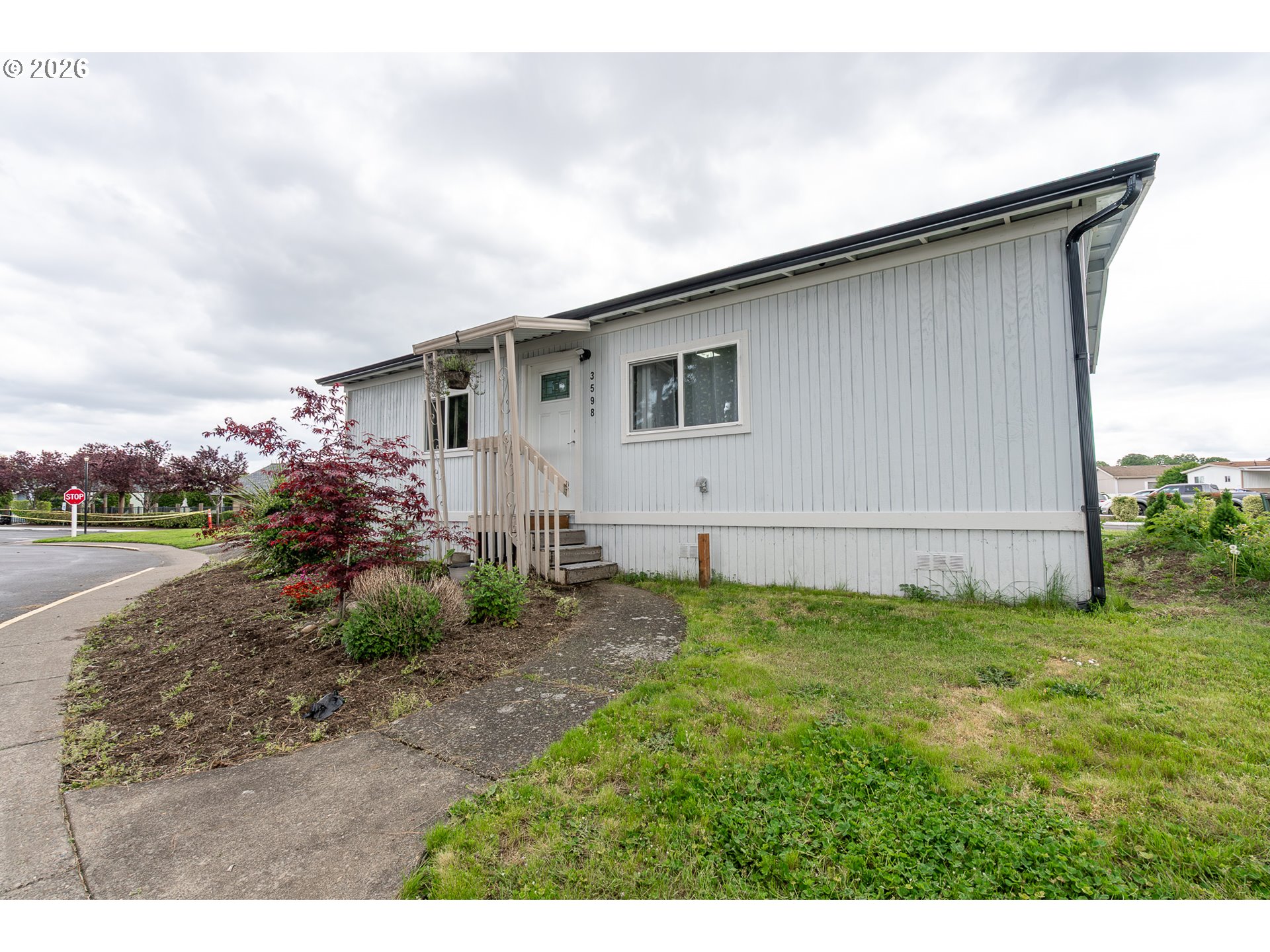 3598 Turner Road Southeast Salem, OR 97302 - Photo 1 of 21 a backyard of a house with potted plants and large tree