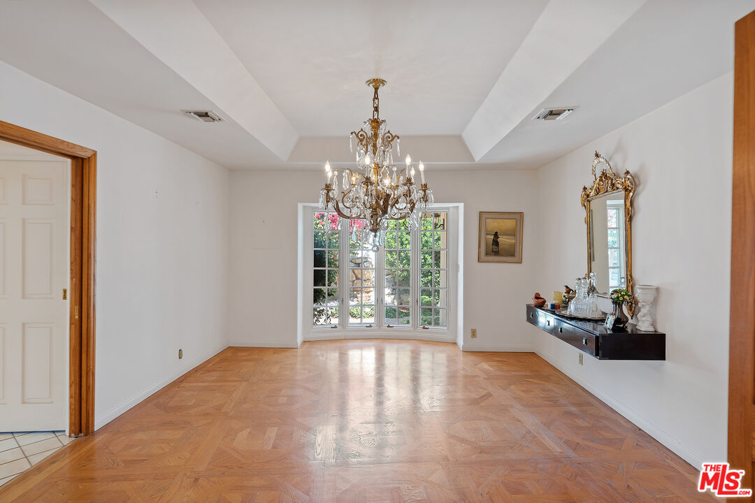 950 Hampton Road Arcadia, CA 91006 - Photo 15 of 33 a living room with hardwood floor and chandelier