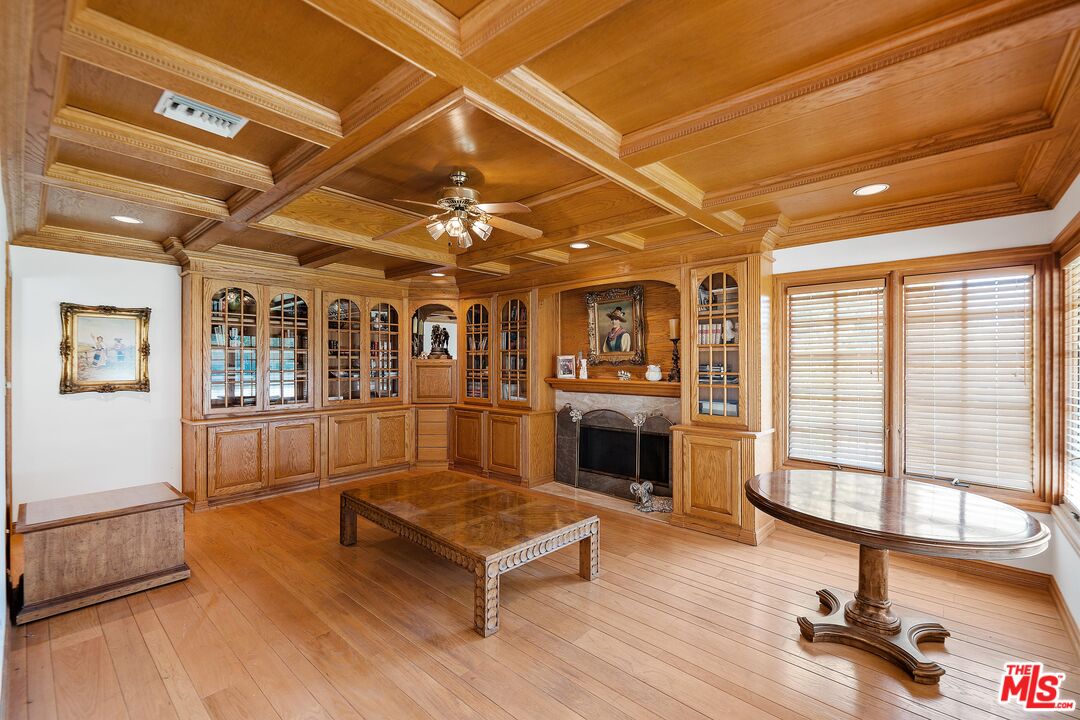 950 Hampton Road Arcadia, CA 91006 - Photo 18 of 33 a living room with furniture a fireplace and wooden floor