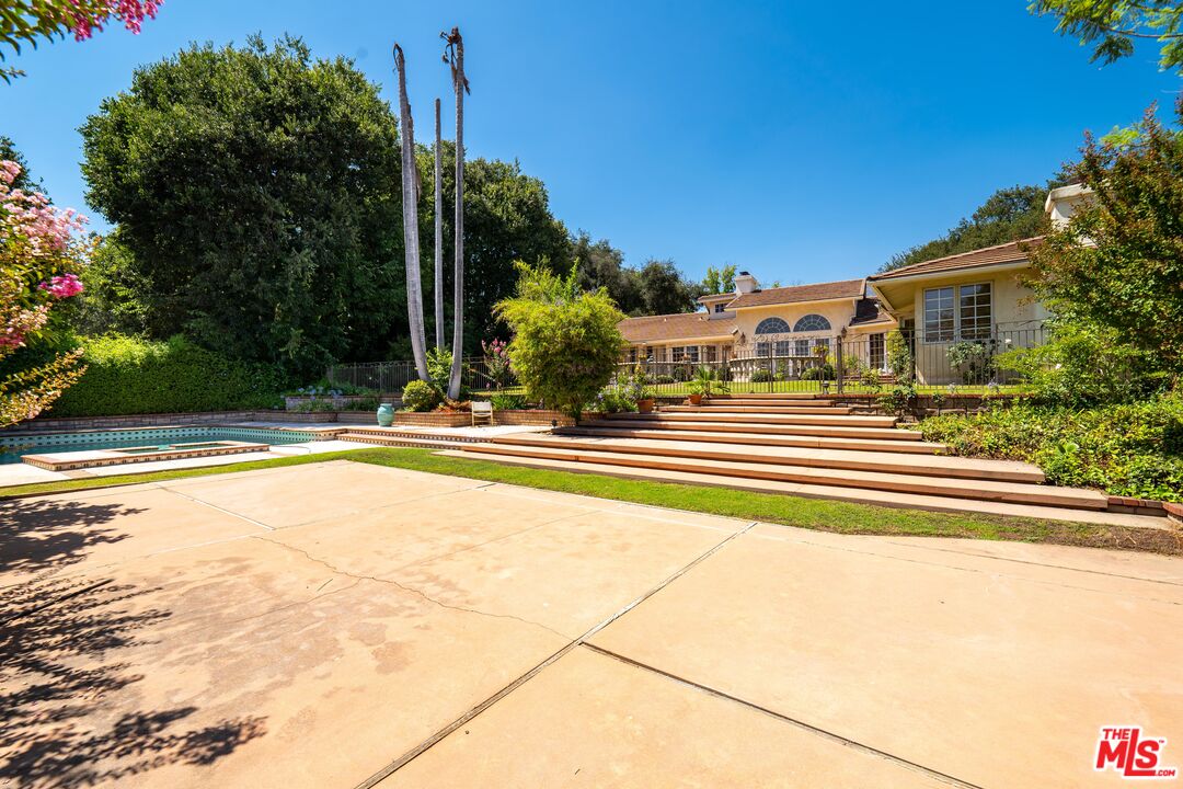 950 Hampton Road Arcadia, CA 91006 - Photo 24 of 33 a view of a swimming pool with a yard and plants