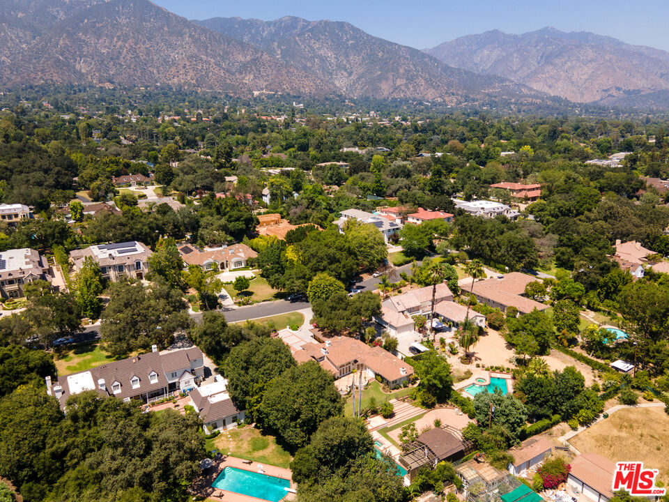 950 Hampton Road Arcadia, CA 91006 - Photo 32 of 33 an aerial view of a city with lots of residential buildings and mountain view in back