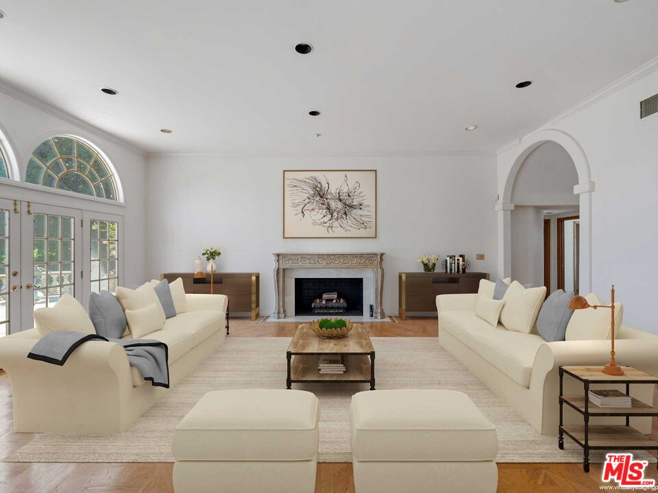 950 Hampton Road Arcadia, CA 91006 - Photo 5 of 33 a living room with furniture a fireplace and a large window