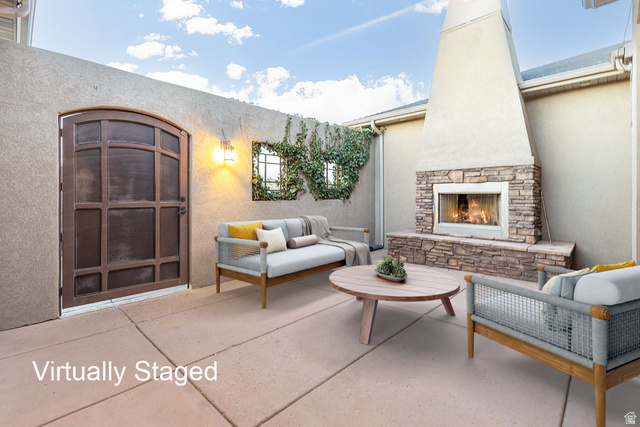 888 East Fiddlers Canyon Road Cedar City, UT 84721 - Photo 7 of 74 View of patio / terrace with an outdoor living space with a fireplace